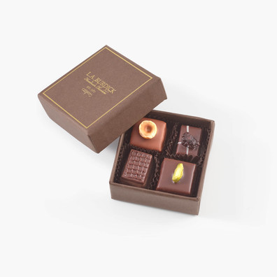 A favor box of a variety of handcrafted chocolate bonbons.
